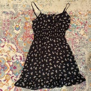 Black sundress with ruffled seam at the bottom. Size medium.